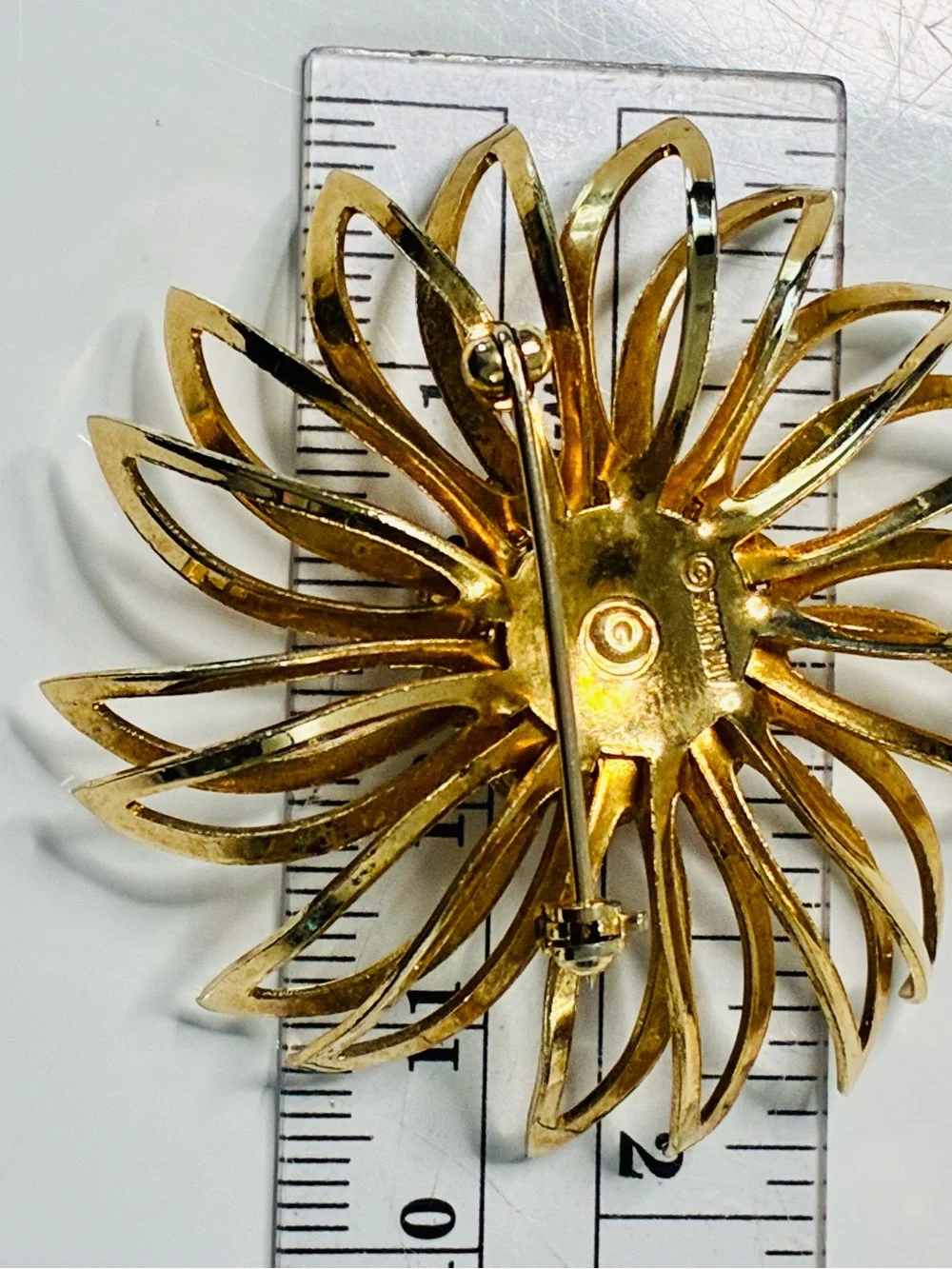 Sarah Coventry Gold-tone Sunburst Brooch with Deep Red Center